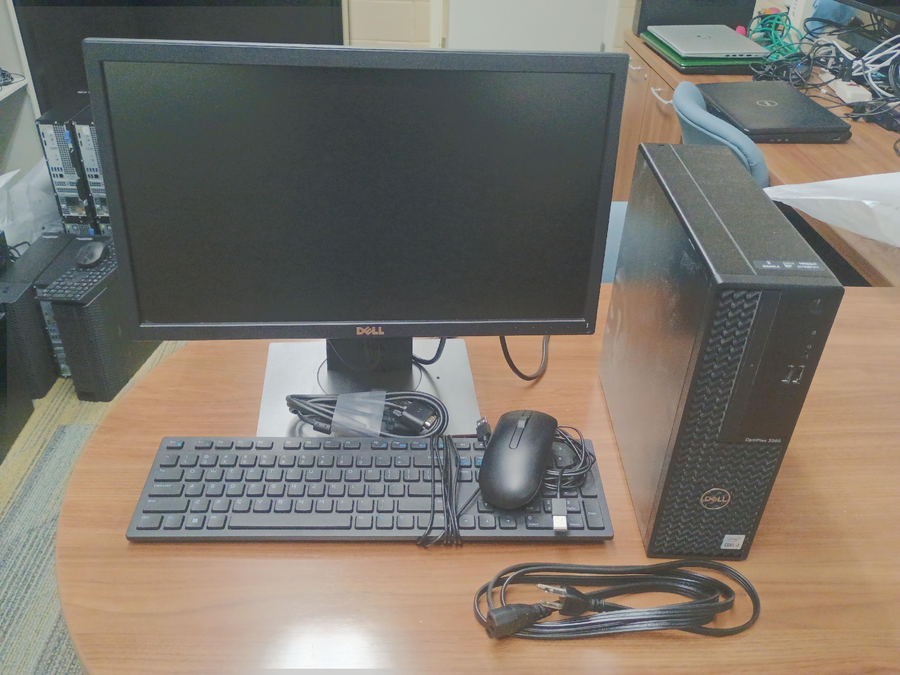 Desktop computer with mouse, keyboard and monitor.