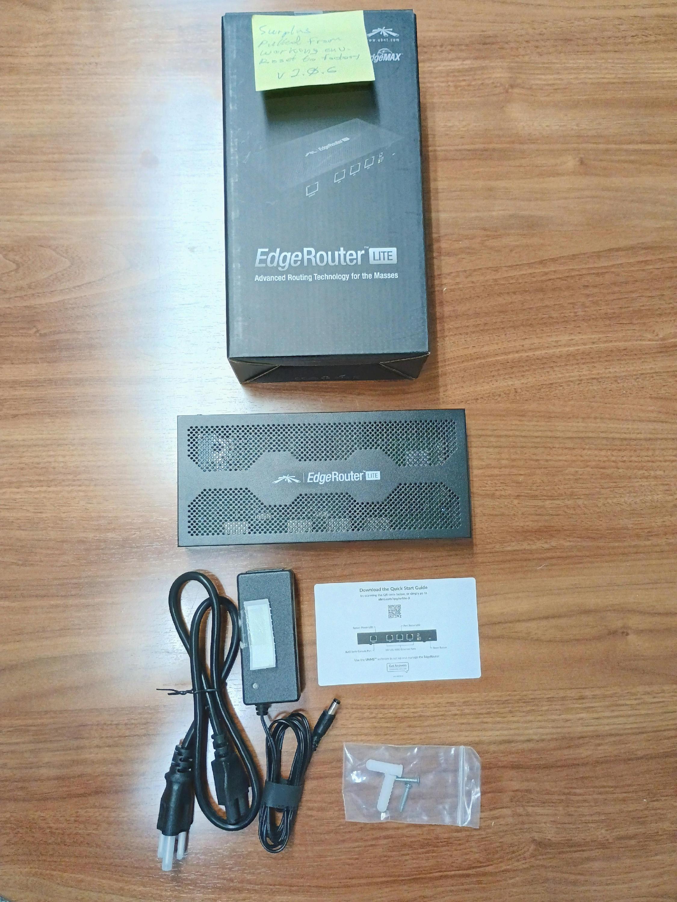 Internet router with power supply, box, power supply, mounting screws and papers.